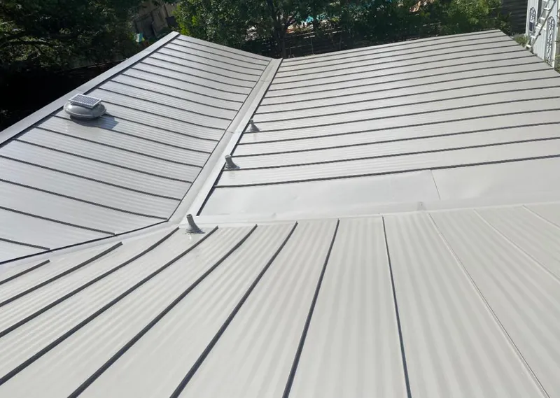 Solar attic fan installed on a metal roof for Roof Ventilation in Winston-Salem